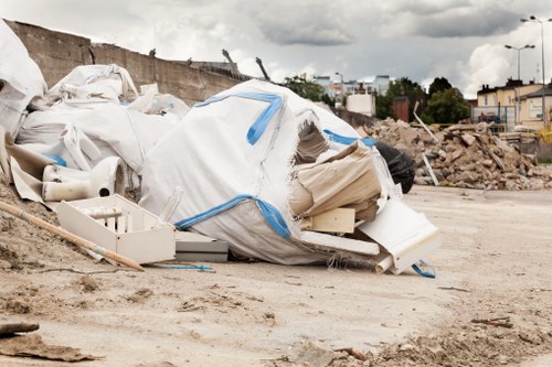 Waste collection vehicle at a commercial site in Earls Court